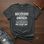 Recovery Is Never Owned- T-Shirt
